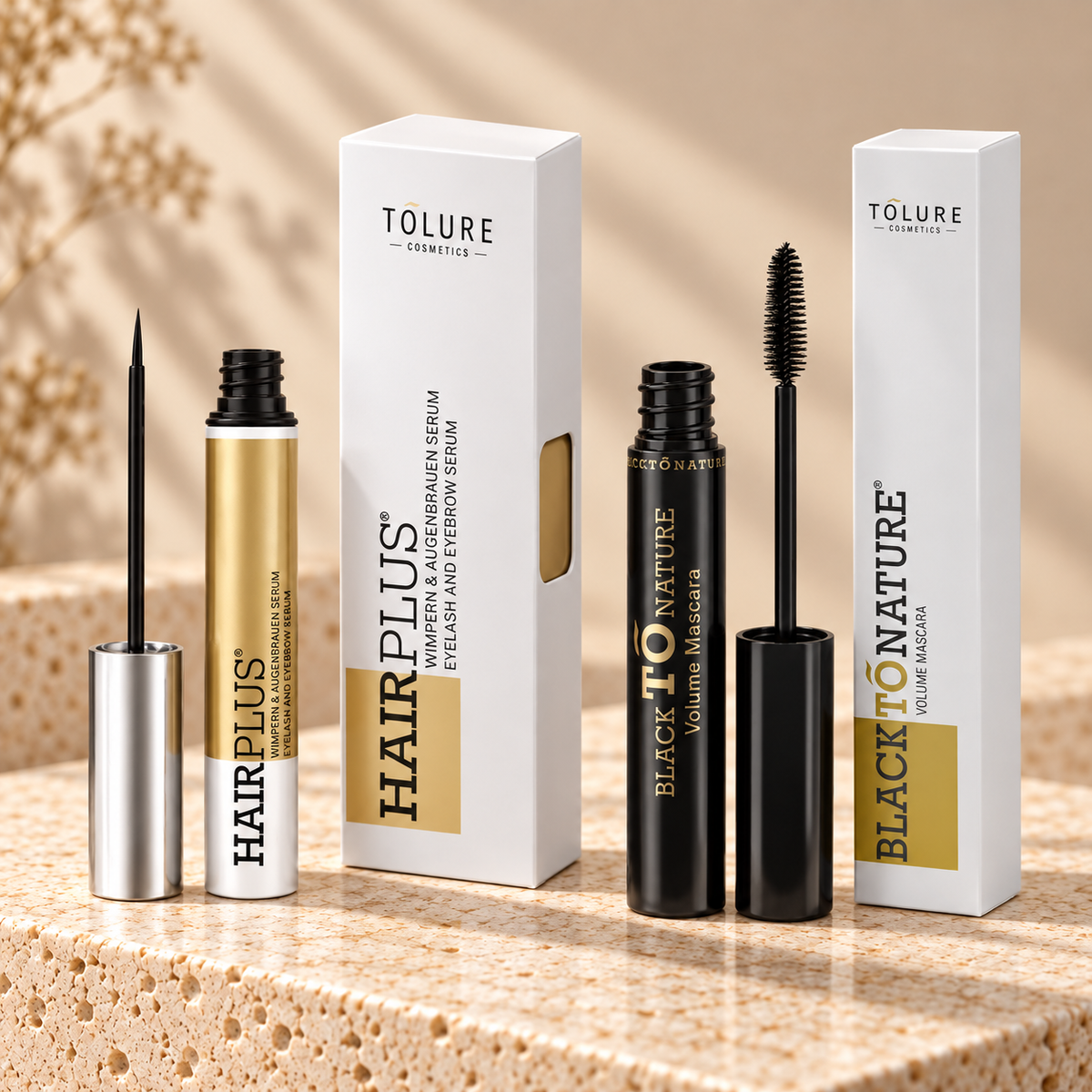 Tolure Hairplus og mascara sæt på travertin i samme beige billedstil.